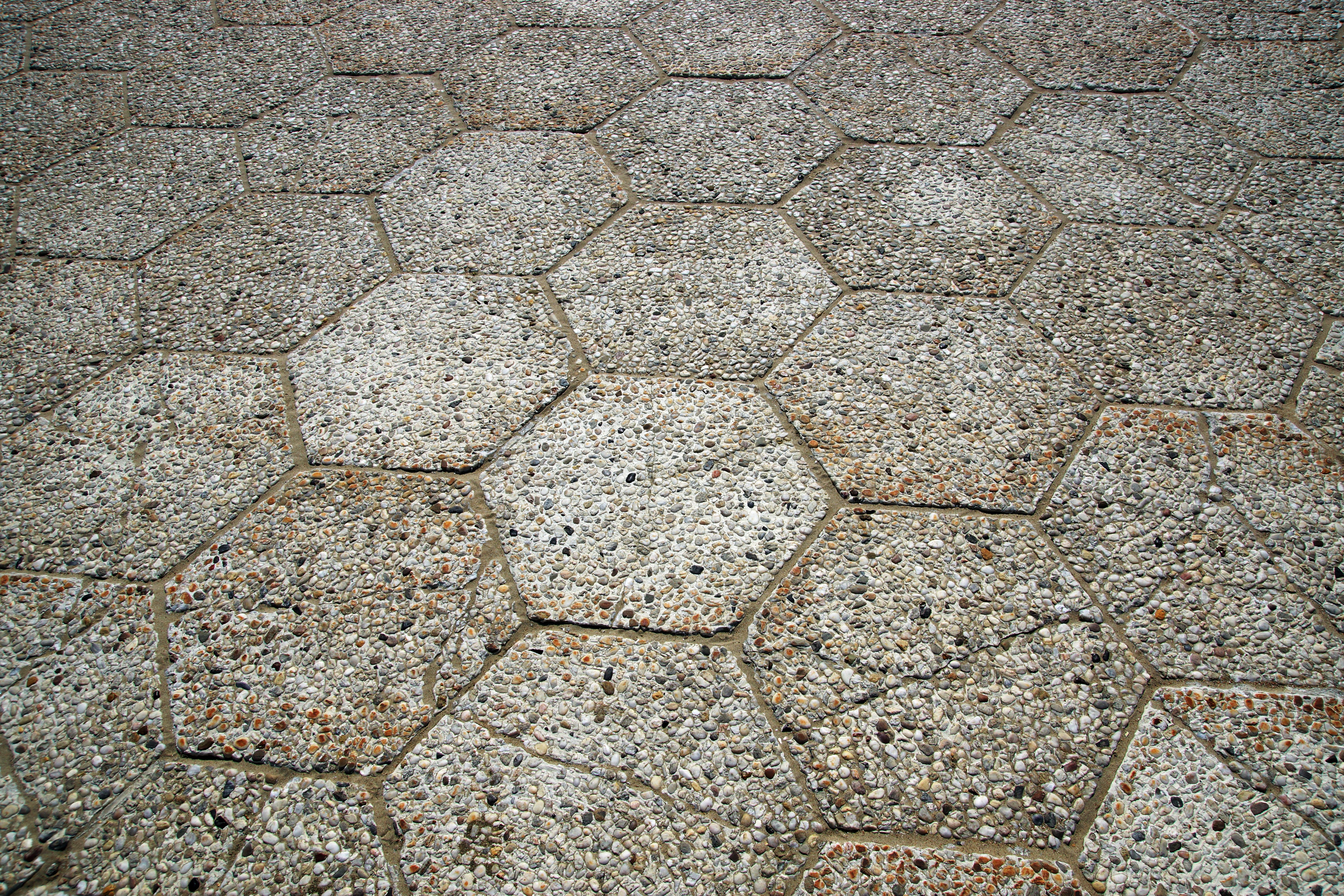 Close-up of hexagonal stone pavement showing textures and patterns